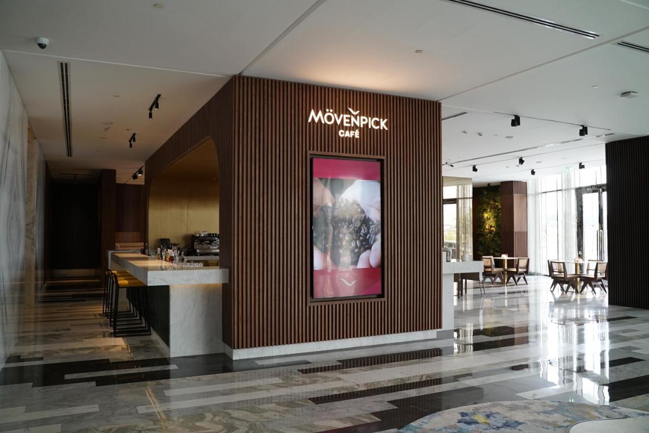 Movenpick Jumeirah Village Triangle Dubái Exterior foto Mövenpick Café in the lobby of the Kempinski Hotel, Amman, Jordan