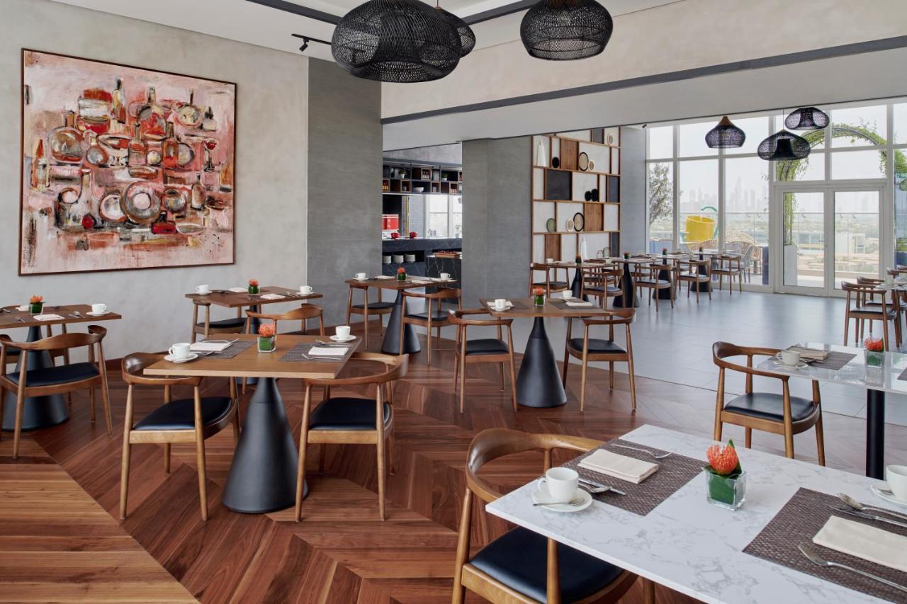Movenpick Jumeirah Village Triangle Dubái Exterior foto The restaurant