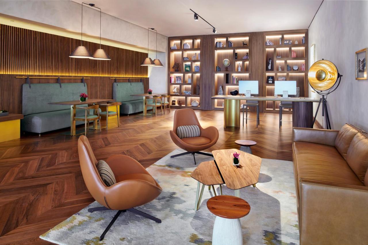 Movenpick Jumeirah Village Triangle Dubái Exterior foto The Library at The Hari